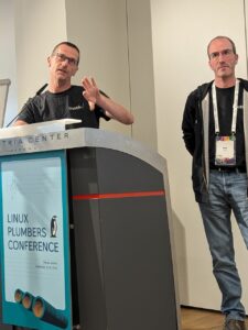 Luca Ceresoli and Hervé Codina speaking at Linux Plumbers conference 2024